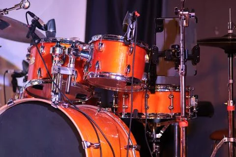 Close-up of orange drum kit on stage. Detailed close-up of an orange drum k.. Stock Photos