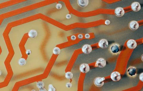 Close up of orange electronic computer circuit board as background Stock Photos