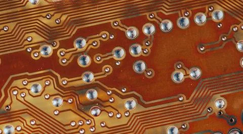 Close up of orange electronic computer circuit board as background Stock Photos