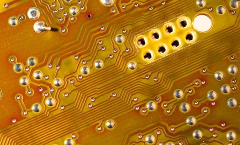 Close up of orange electronic computer circuit board as background Stock Photos