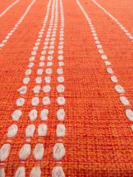 Close up of orange fabric patterns with white lines Stock Photos