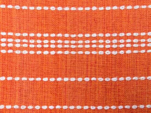 Close up of orange fabric patterns with white lines Stock Photos