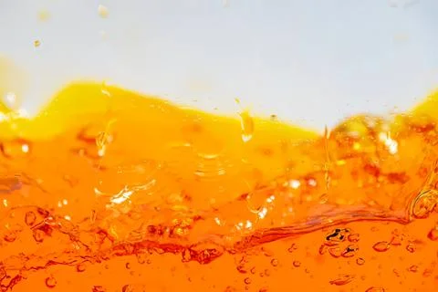 Close-up of orange juice splash with bubbles and liquid motion Stock-Fotos