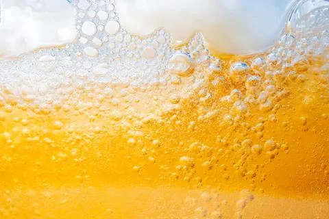 Close-up of orange juice splash with bubbles and pulp Stock Photos