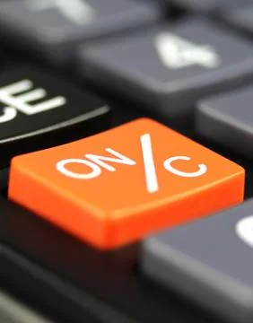 Close up orange power button (ON/C) in calculator 스톡 사진