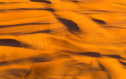 Close up orange sand texture in Empty Quarter Desert in United Arab Emirates. Stock Photos