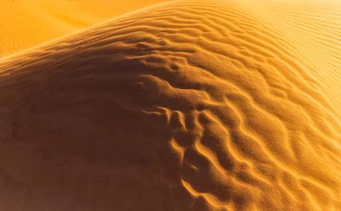 Close up orange sand texture in Empty Quarter Desert in United Arab Emirates. Stock Photos
