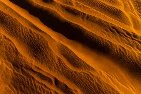 Close up orange sand texture in Empty Quarter Desert in United Arab Emirates. Stock Photos