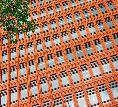 Close-up on an orange skyscraper building tower Foto stock