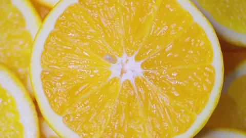 Close-up of orange slices spinning in a circle. Fruit orange. Stock Footage 249272810