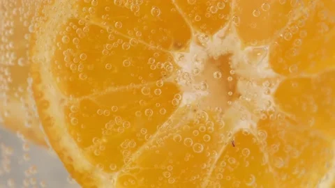 Close-up of orange slices in water with bubbles Stock Footage 187559248
