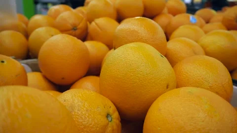 Close-up of oranges lying in a store. Lots of oranges. Stock-Footage 309883363