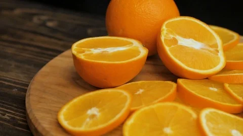 Close up  of oranges on a wooden table Stock Footage 103681536