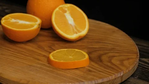Close up  of oranges on a wooden table Stock Footage 103681846