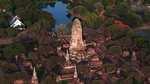 Close orbit aerial motion of Wat Phra Ram ruins showing detailed prang and Stock Footage 312538313
