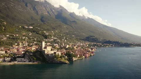 Close Orbit Drone around Malcesine Castle and Coastal Houses, Italy Stock Footage 316695334