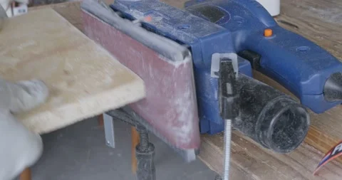 Close-up of orbital sander fixed with clamps on a wooden surface with which a Stock-Footage 152582857