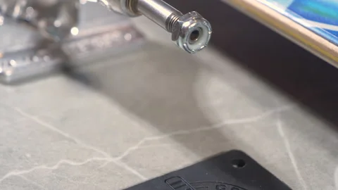 CLOSE UP: Ordered sequence of individual skateboard parts and tool on countertop Stock Footage 195940609