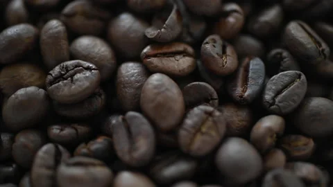 Close up of organic coffee bean with panning motion and multi focus spot Vidéo 158623481