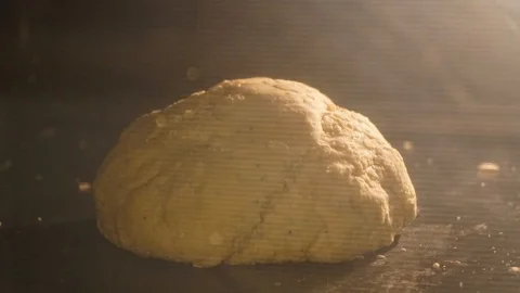 Close up of organic fresh loaf of bread baking in the oven of a kitchen Stock Footage 126621837
