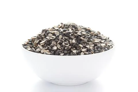 Close up of Organic split black urad dal (Vigna mungo) with shell inside a ce 스톡 사진
