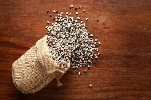 Close-up of Organic split black urad dal (Vigna mungo) with shell spilled out Stock Photos