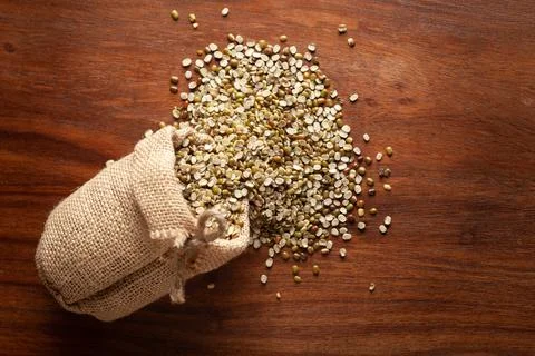 Close-up of Organic split green urad dal (Vigna mungo)  spilled out from a la Stock Photos