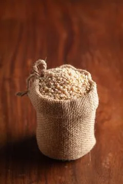 Close-up of Organic split polished white urad dal (Vigna mungo) in a standing Photos