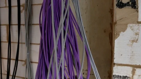 Close up of organised cables hanging down from ceiling in a new build Stock Footage 112614950