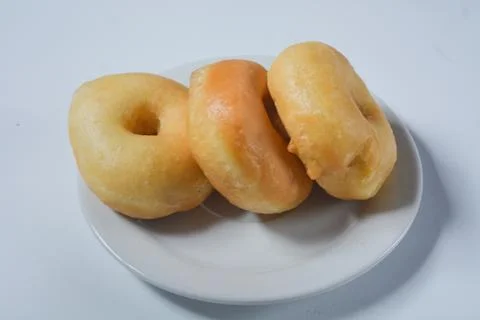 Close up of original donuts without toppings on a white background. Isolate.. Stock Photos