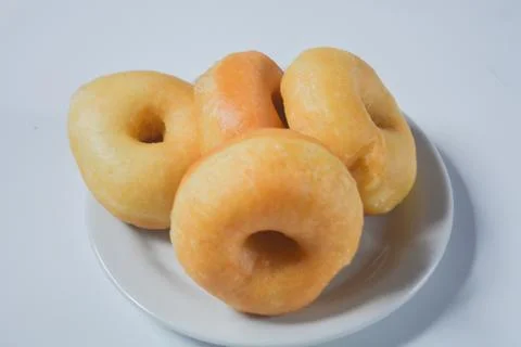 Close up of original donuts without toppings on a white background. Isolate.. Stock Photos
