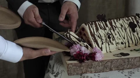 Close-up of the original triangular wedding cake. The bride and groom cut the Stock-Footage 135045396
