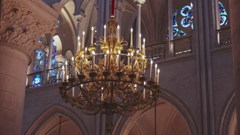 Close up of ornate brass chandelier inside Notre Dame Cathedral in Paris, 4K 库存影片 344682155