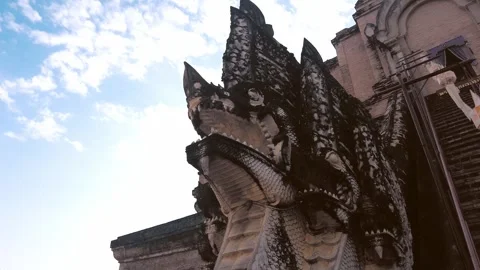 Close up ornate Naga serpent statues, intricately carved, guard the entrance Stockbeeldmateriaal 341528237