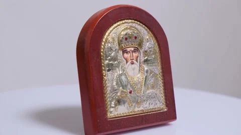 Close-up of the Orthodox icon of St. Nicholas on rotating table Video stock 141051773