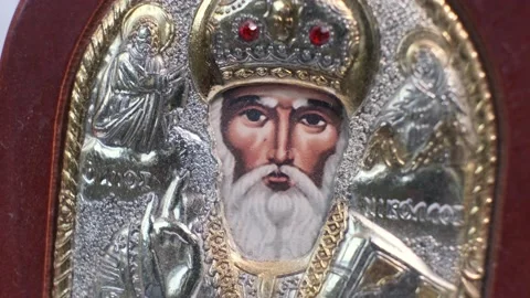 Close-up of the Orthodox icon of St. Nicholas on a rotatng table. Stock Footage 141331287