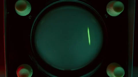Close-Up of Oscilloscope Displaying Green Waveform Signal Stock Footage 291922851
