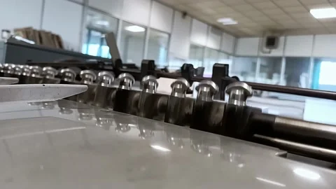 Close up of an oset printer while printing Stock Footage 130979850