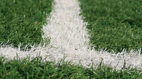 Close up of the out of bounds line on a turf football field 動画素材 66295401