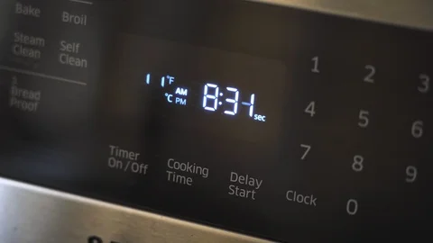Close up of oven display flickering control panel blinking Electricity problem Stock Footage 129136291