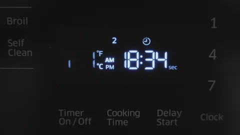 Close up of oven display flickering control panel blinking Electricity problem Stock Footage 129136370