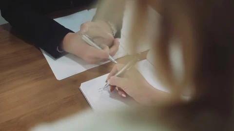 Close up over shoulder shot of man and woman hands business meeting in office. Stock Footage 116687686