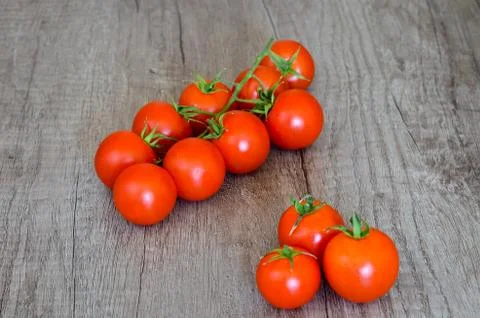 Close up overhead  cherry tomatoes  clusters on table. Stock Photos