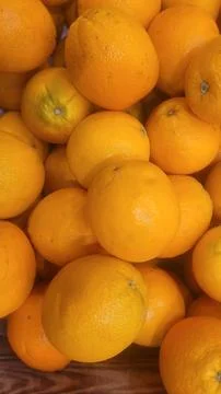 Close-up overhead of oranges on display, perfect for health and nutrition. Stock Photos