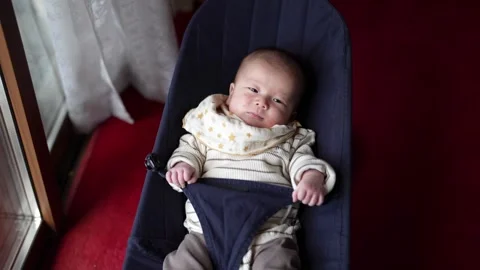 Close overhead view of an alert infant Vídeo Stock 344015649