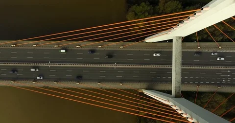Close Up Overhead View Of A Bridge With Orange Ropes. Traffic Passing By Stock Footage 86319978