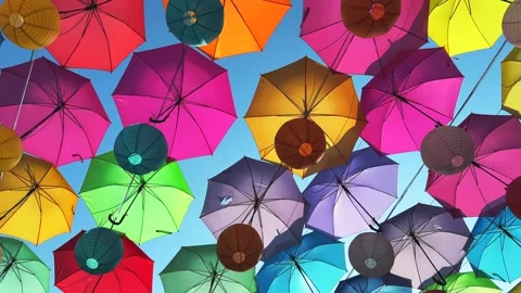 Close up Overhead View of Colorful Umbrellas Roof and blue sky Stock Footage 340118887