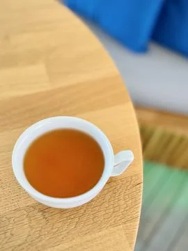 Close-up overhead view of a cup of green tea on a wooden table Stock Photos