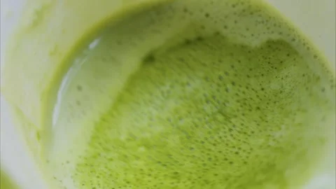 Close up overhead view of green matcha tea or coffee with milk foam, creati.. Stock Footage 339441887