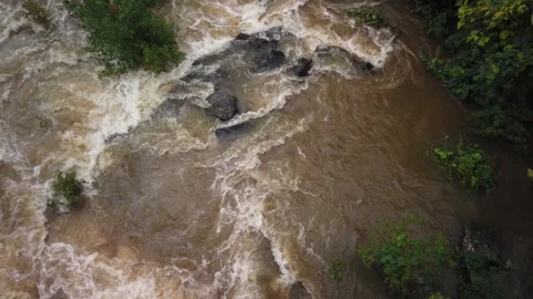 Close Up Overhead view looking down at river rocks in a swift fast moving, churn Stock Footage 286867386